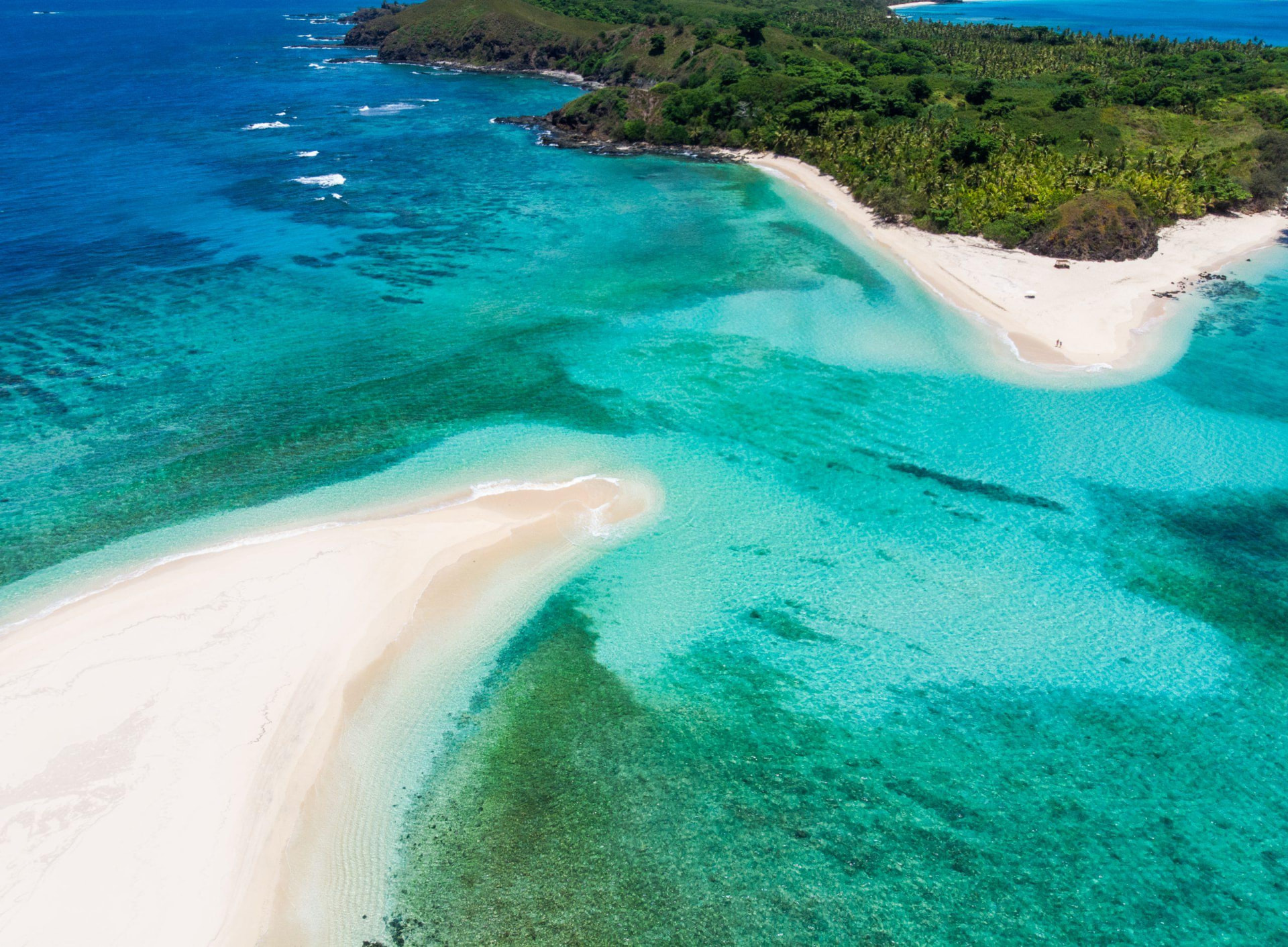 Aerial view of a white-sand bar and turquoise reef in the Yasawa Islands, Fiji