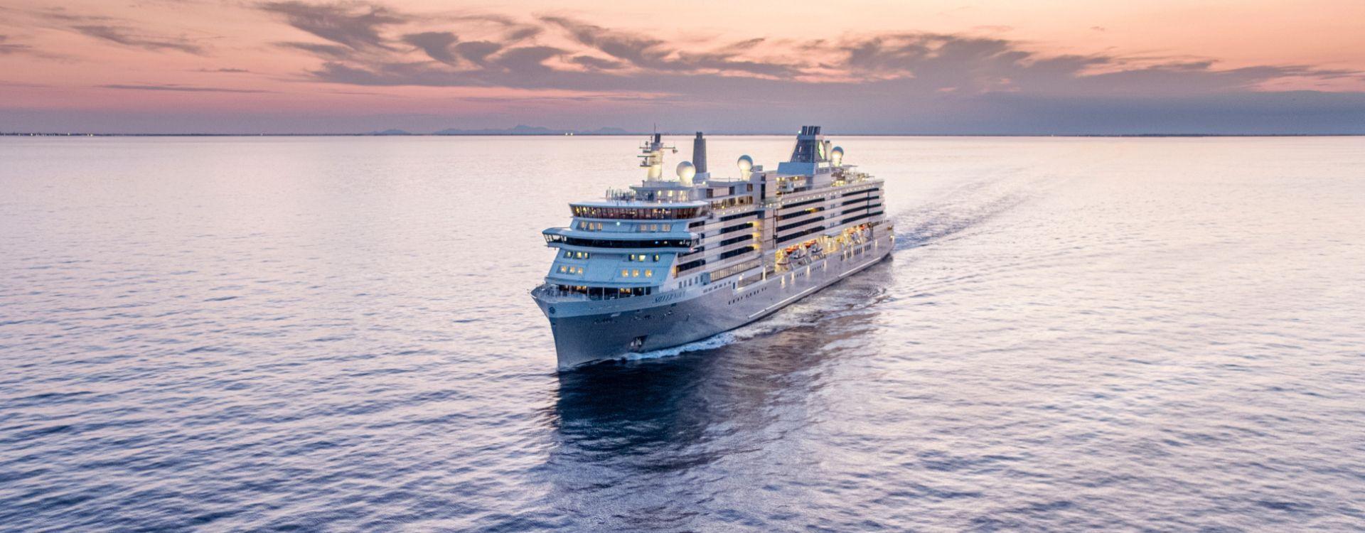 Silversea cruise ship sailing at sunset on calm water