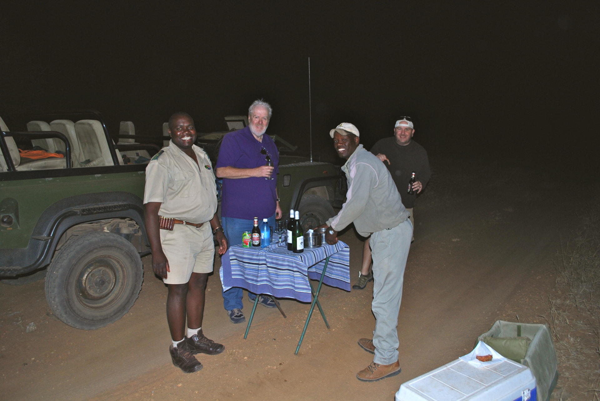Sundowner drinks with the guides at the end of an evening game drive in South Africa