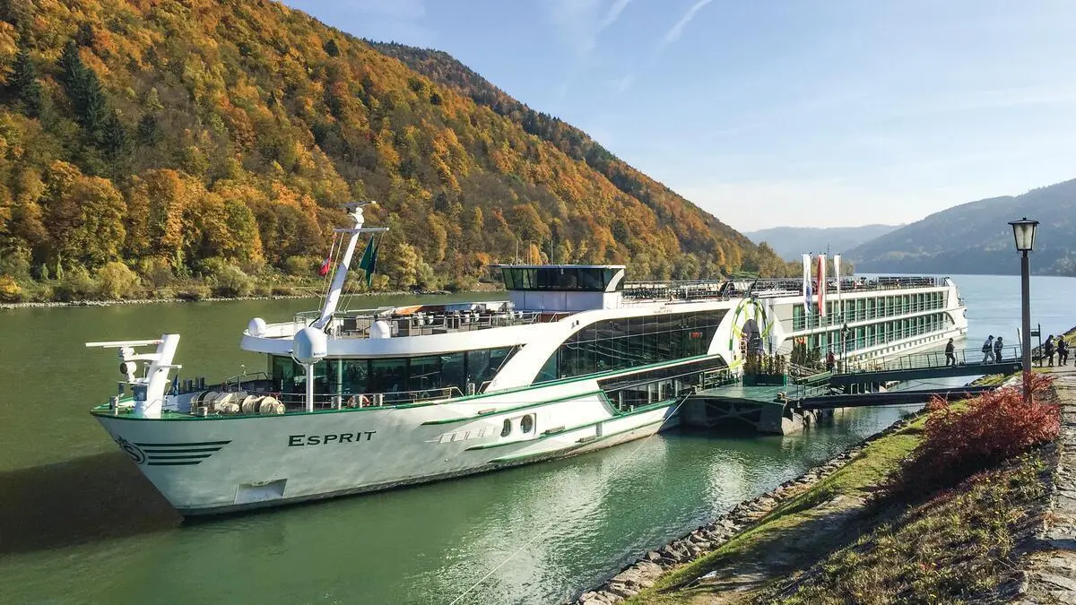 Tauck's ms Esprit docked on the Danube in Austria among autumn hills