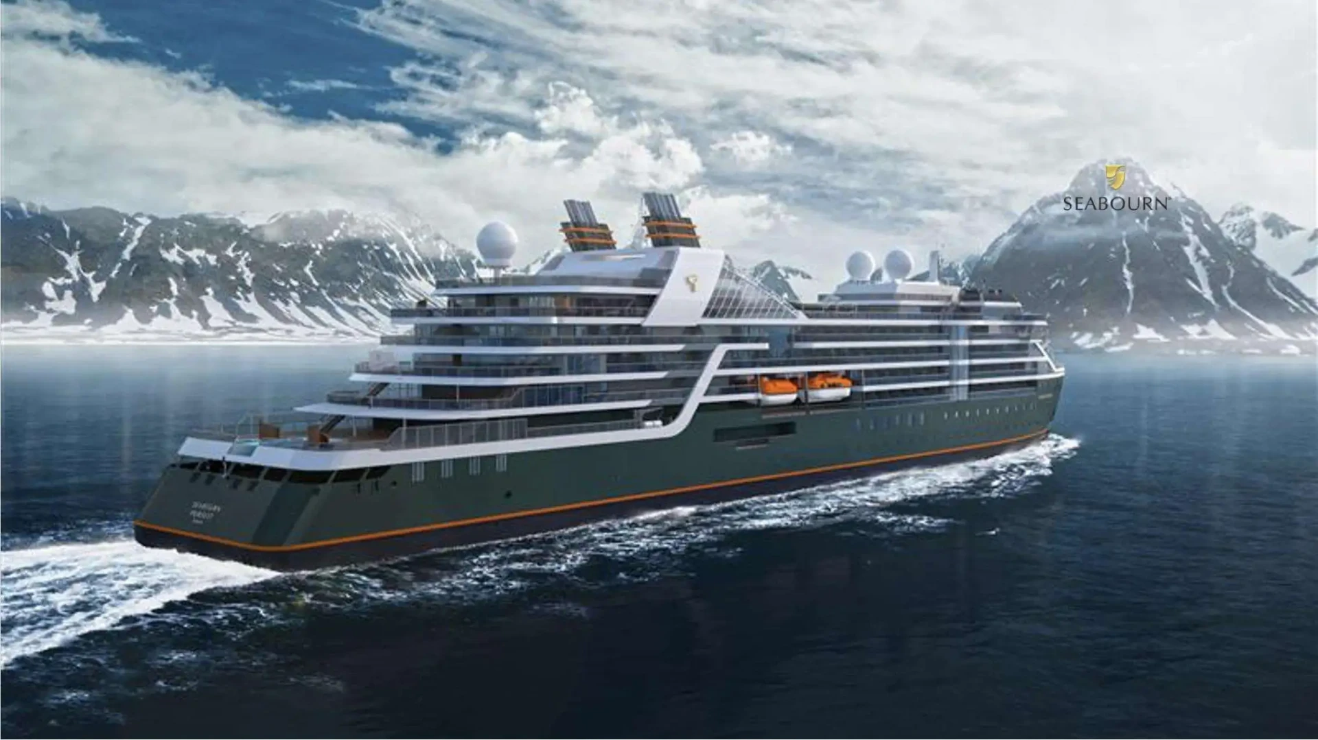 Seabourn Pursuit sailing past snow-covered mountains in Antarctica