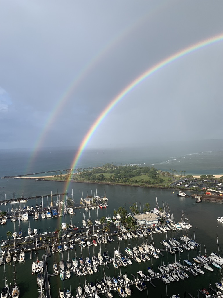 A double rainbow over the Ala Wai Harbor and Magic Island in Honolulu, Oahu, Hawaii