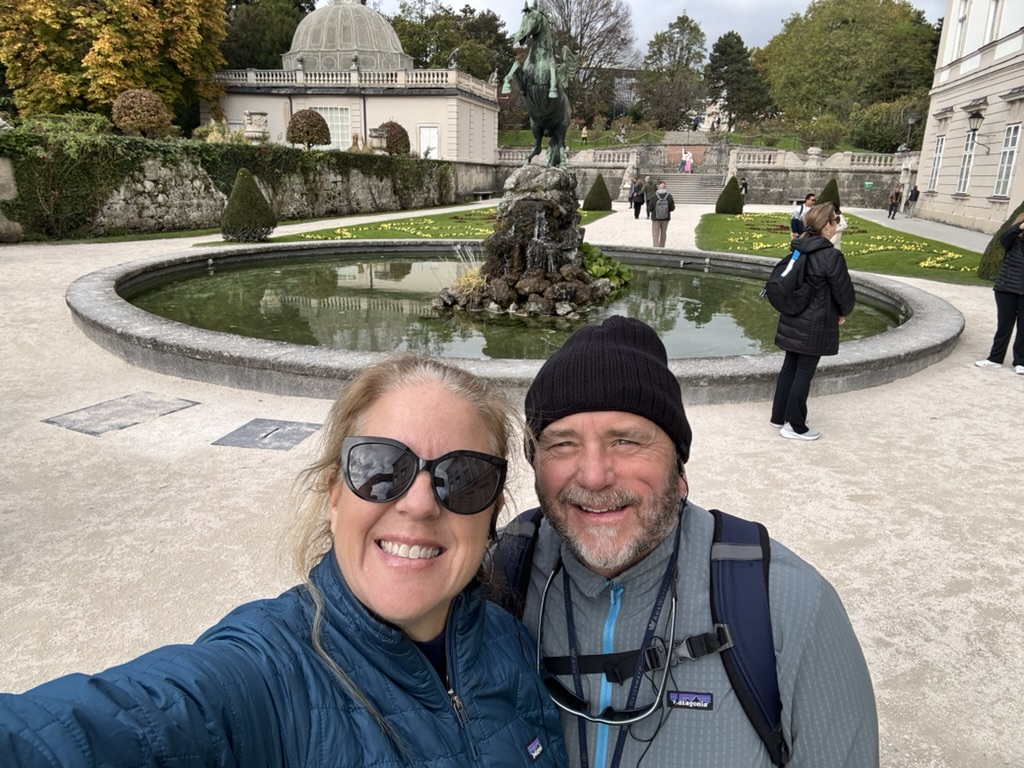 Susan Green and her husband by the Pegasus Fountain in the Mirabell Gardens, Salzburg, Austria