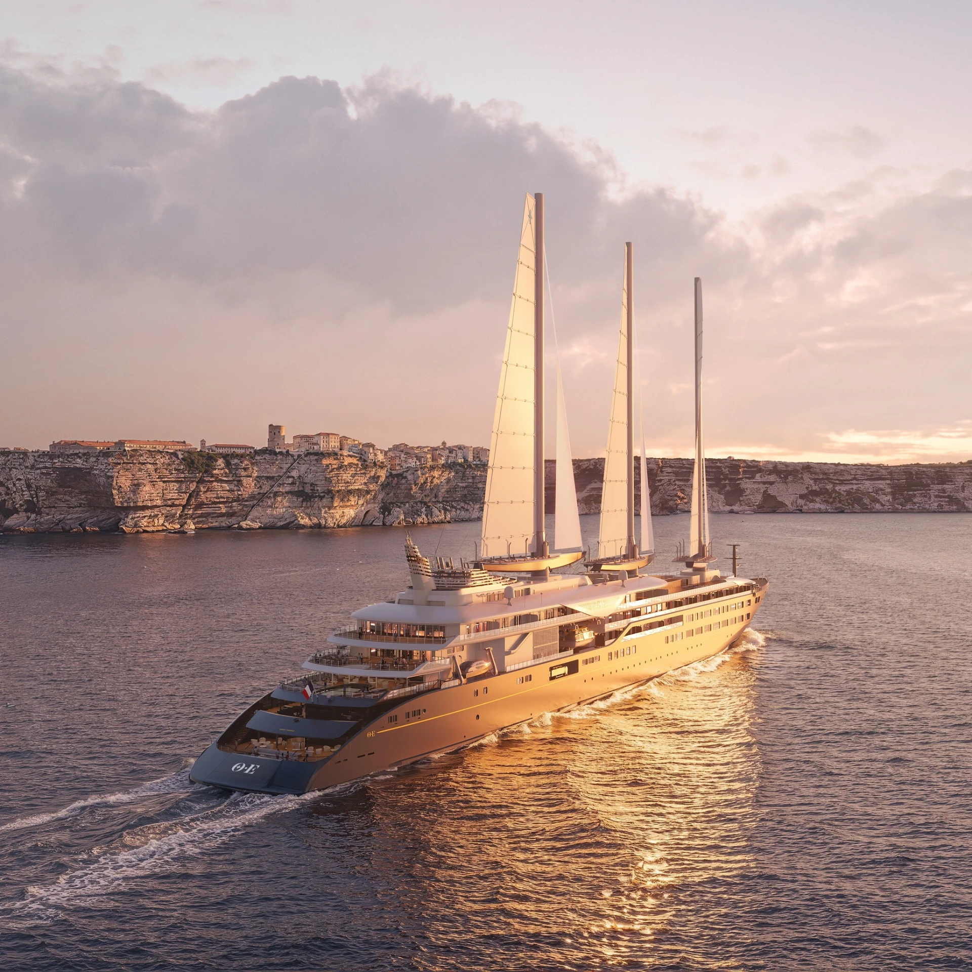 Orient Express Corinthian sailing yacht under full sails off the cliffs of Bonifacio at sunset