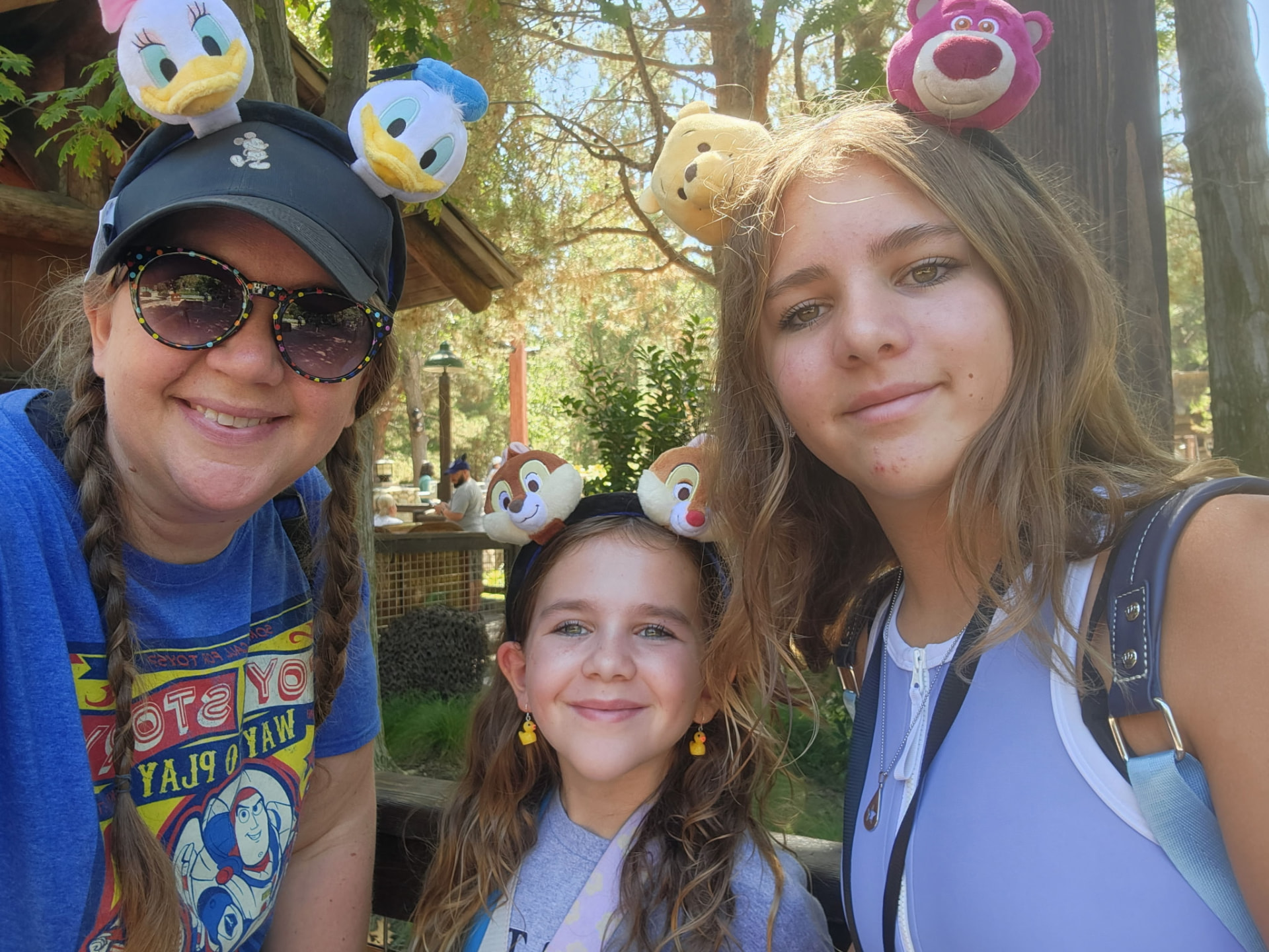 Kim Koldykowski with her daughters wearing Disney character ears at Walt Disney World