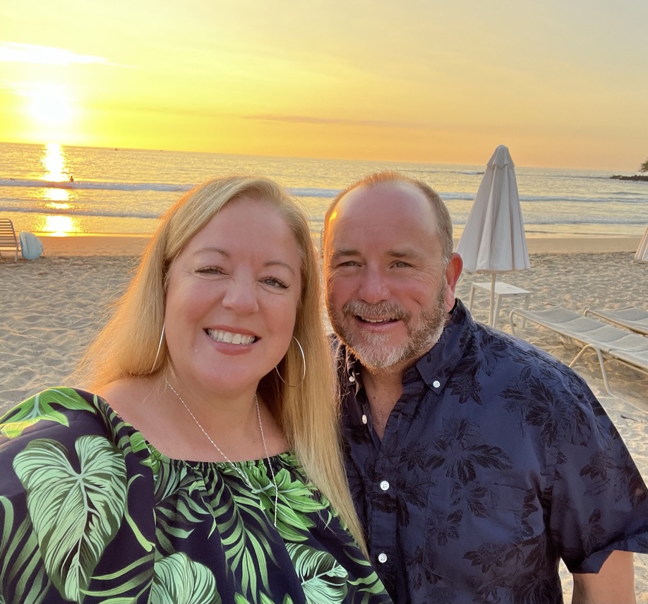 Susan Green and her husband on the beach at Mauna Kea Beach Hotel on the Kohala Coast of the Big Island, Hawaii, at sunset