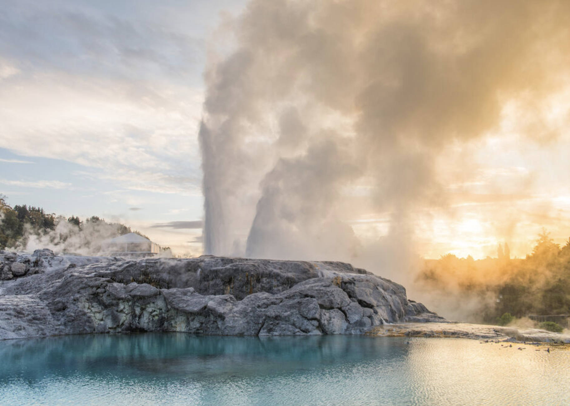 Pōhutu Geyser erupting at sunrise in Rotorua, New Zealand