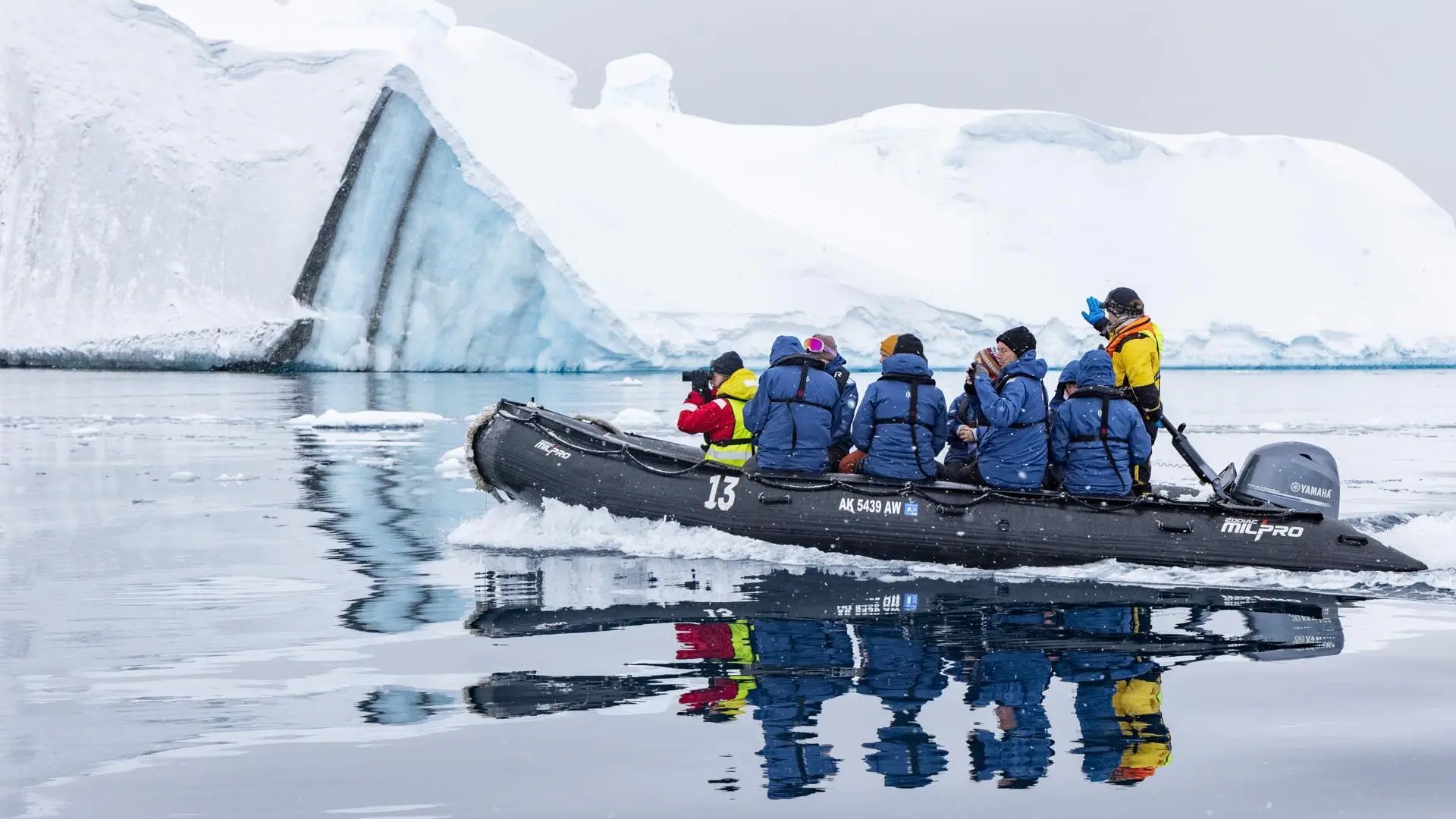 Expedition Zodiac cruising among icebergs in Antarctica