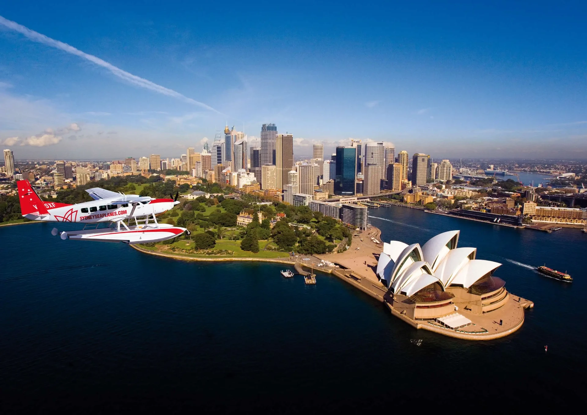 Seaplane flying over Sydney Harbour and the Opera House
