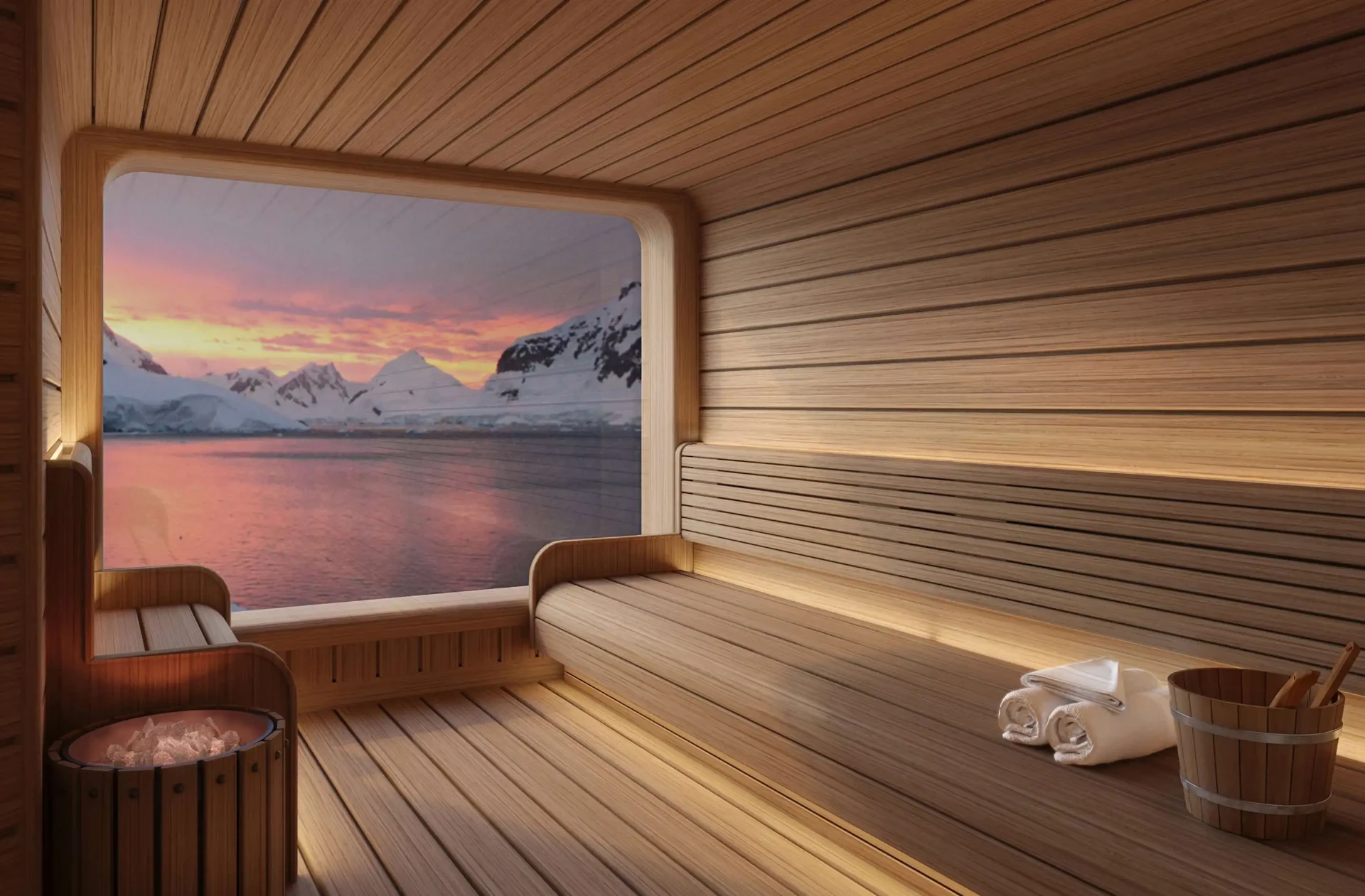 The sauna on Seabourn Pursuit looking out over water and snow-covered mountains at sunset in Antarctica